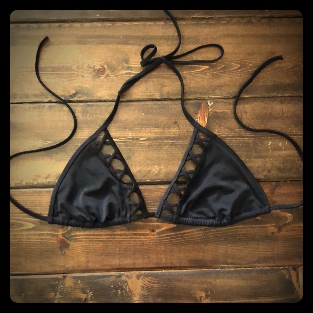 Black Victoria’s Secret bikini top with cutouts